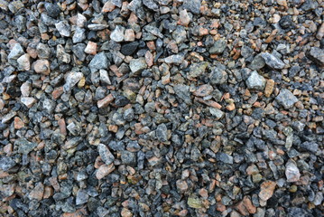 Building materials and fettling background, light crushed stone after rain