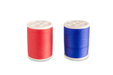 Roll red and blue thread bobbin thread isolated on white background with clipping path