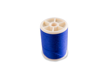 Roll blue thread bobbin thread isolated on white background with clipping path