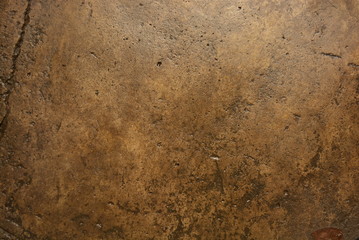 Building materials, wet concrete asphalt old after a rainstorm very bright brown background