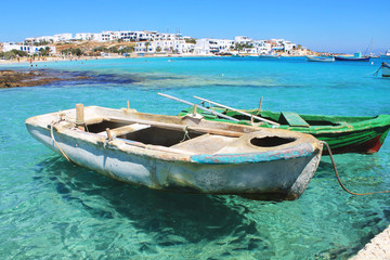 Fototapeta na wymiar Old boats on an island's harbor