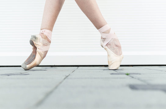 Ballerina's legs in pointe shoes