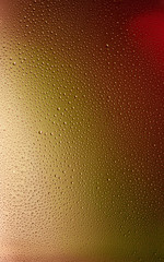 Small water drops on the glass