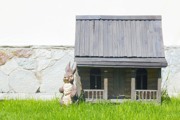 Toy wooden house and bunny