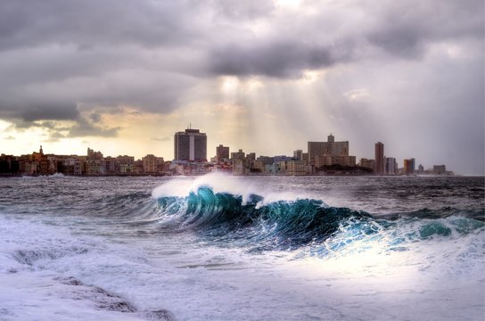 Stormy weather hitting The Malecon in Havana, waves crash over the protective seawall in these dramatic weather images, Cuba