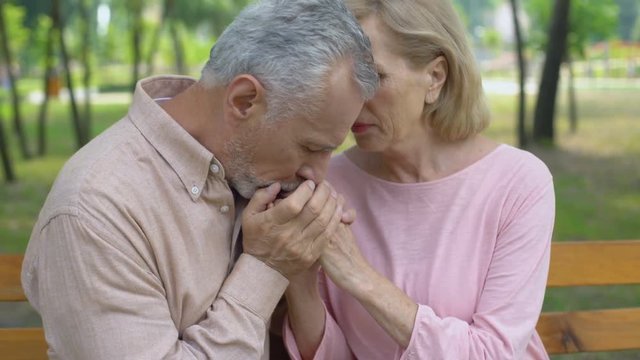 Old husband embracing ill wife, love until old age, support, care, togetherness