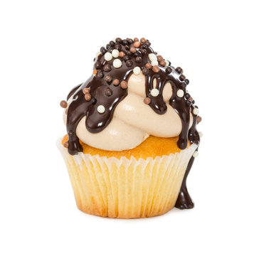 Cupcake With Chocolate Syrup And Sprinkles Isolated On White