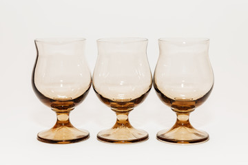Glass wine glasses on white background.