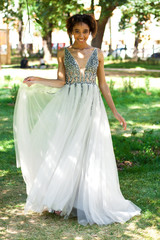 Fototapeta premium Sexy african woman in white long dress
