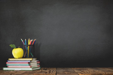 Back to School Concept with Stationery Supplies and Blackboard