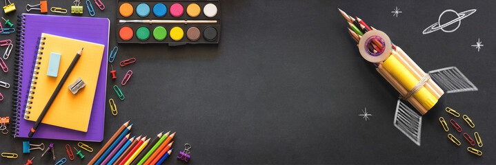 Back to School Concept with Stationery Supplies and Blackboard