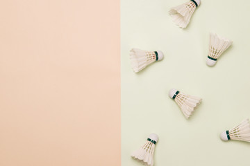 top view of composition with badminton shuttlecocks on pastel color background