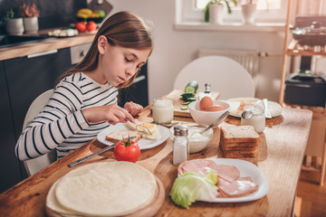 Girl having breakfast at home