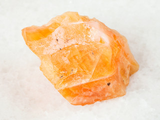 raw fire opal gemstone on white