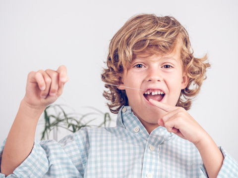 Little boy pulling tooth out