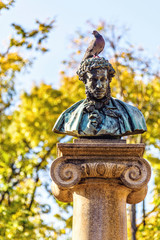 Statue of Alexander Pushkin with a bird sitting on head