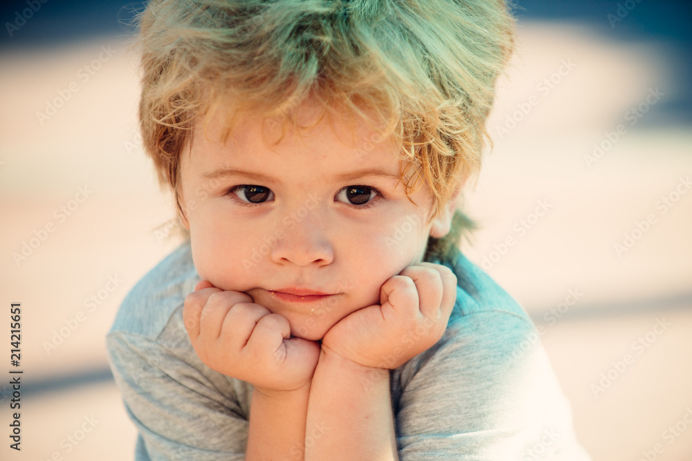 Wall mural close-up portrait of child. funny little kid boy. 3 years old. cute kid face. smart child, sadness a