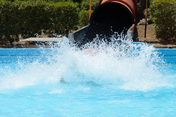 people ride water slides in the water park