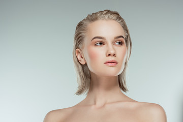 portrait of blonde girl, isolated on grey, natural beauty