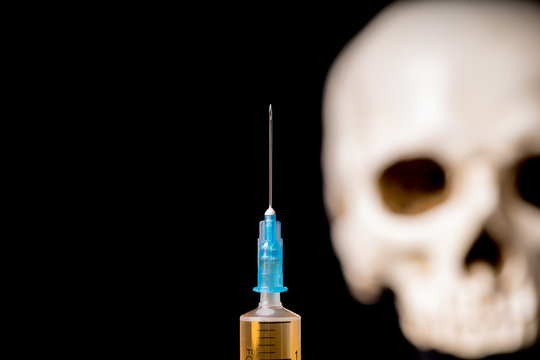 Syringe and skull