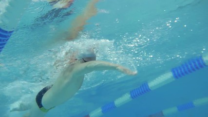 Underwater view swimmer swim training in slow motion freestyle crawl