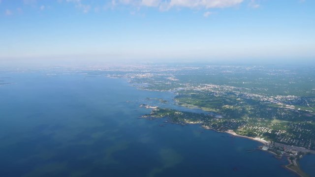 An aerial view of the eastern United States coastline on a sunny summer day.  	