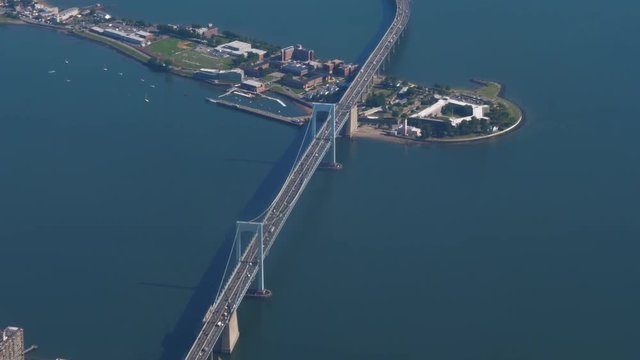 A high angle aerial view of the Throgs Neck Bridge connecting New York City's Queens and Bronx boroughs.	 	