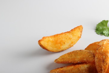 country slices potatoes on white background