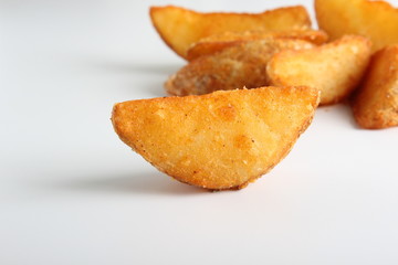 country slices potatoes on white background