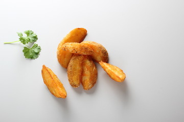 country slices potatoes on white background