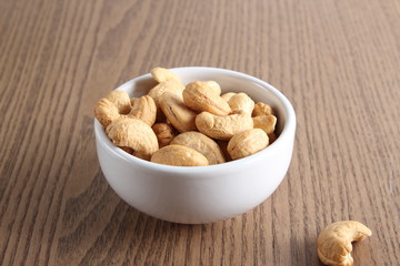 cashew nuts on wooden background