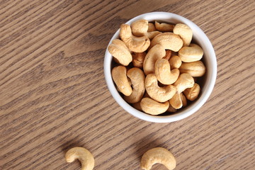 cashew nuts on wooden background