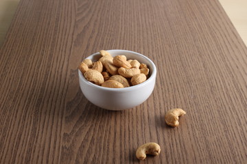 cashew nuts on wooden background