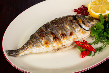 Grilled dorada served lemon