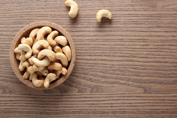 cashew nuts on wooden background