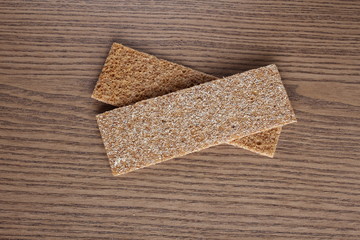 rye cpispbread on a wooden background