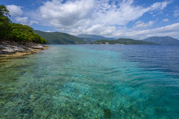 Desimi Beach Golf and nearby Island with clear water in Greece