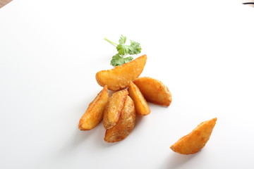 country slices potatoes on white background
