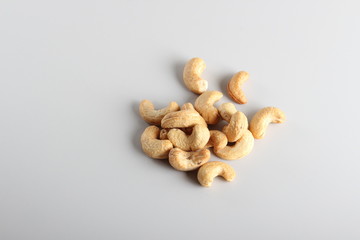 Fototapeta na wymiar cashew nuts on gray background