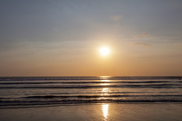 Fototapeta na wymiar Beautiful sunrise over the tropical beach in Bali Indonesia