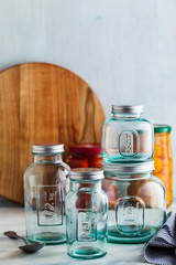 Glass jars, ready for sterilization and canning. preservation of food on a marble table.
