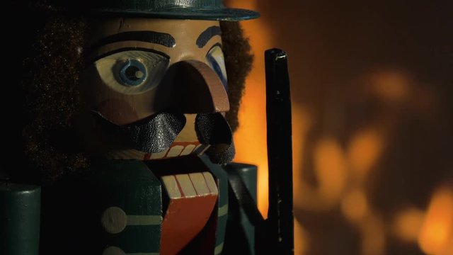 Head of an Nutcracker Figuring in Front of Flames