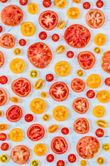 Slices of Tomatoes Over Blue Background