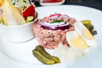 tasty Steak tartare (Raw beef) - classic steak tartare on white plate