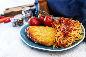Escalope of spaghetti with tomatoes sauce and basil