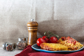 Escalope of spaghetti with tomatoes sauce and basil