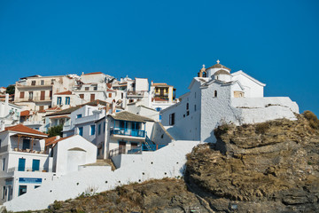 Small white church on a hill over Skopelos town at summer morning, island of Skopelos, Greece - obrazy, fototapety, plakaty