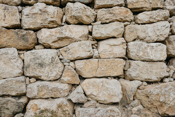 Wall of the ancient brown sandy stones
