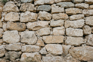 Wall of the ancient sandy stones in Spain