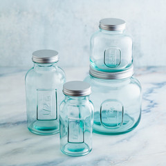 Glass jars, ready for sterilization and canning. preservation of food on a marble table.